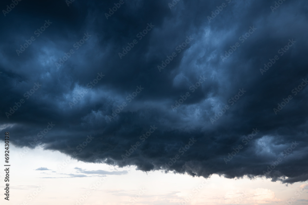 Obraz premium Light in the and Dramatic Storm Clouds background