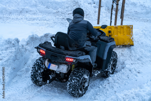 snow removal with a quad bike