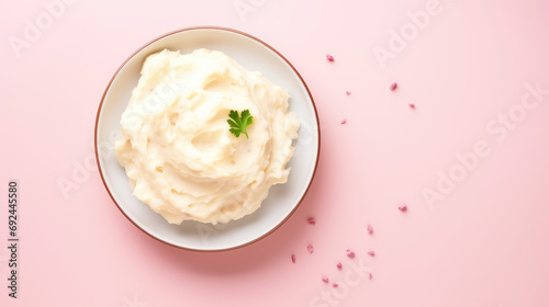 Top view Plate of creamy mashed potatoes, vegetarian tender side dish. Puree from potato made by mashing boiled potatoes and mixing chopped chili, onion, salt and mustard or butter oil.