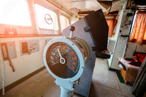 Navigational bridge and control device on old abandoned ship photo