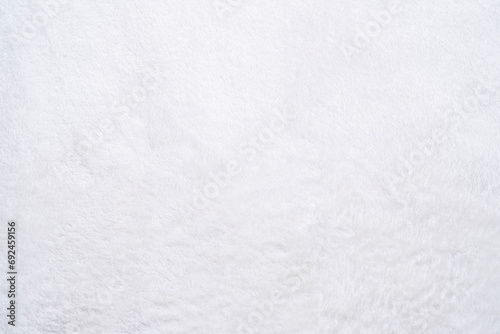 The texture of a white soft material with a high fluffy pile.