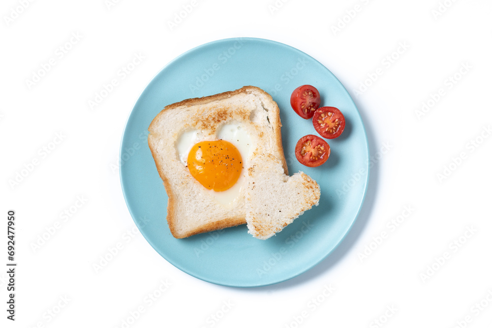 Valentine's Day breakfast with egg with tomatoes, heart shaped and toast bread isolated on white background Valentine's Day breakfast with egg with tomatoes, heart shaped and toast bread isolated on white background