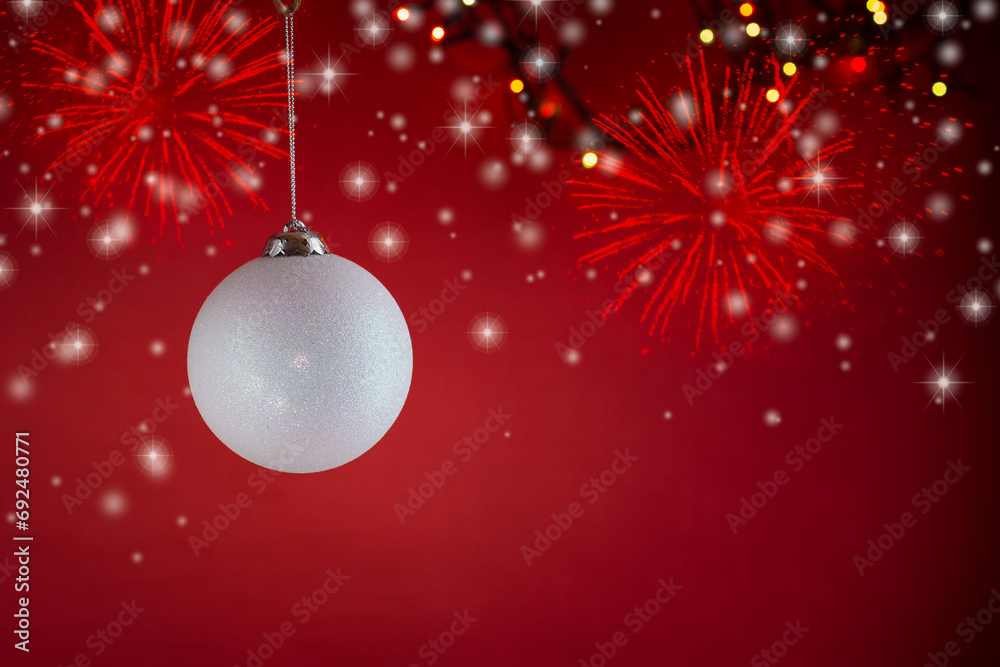 New Year's toys, decorations and other items on a red abstract background.