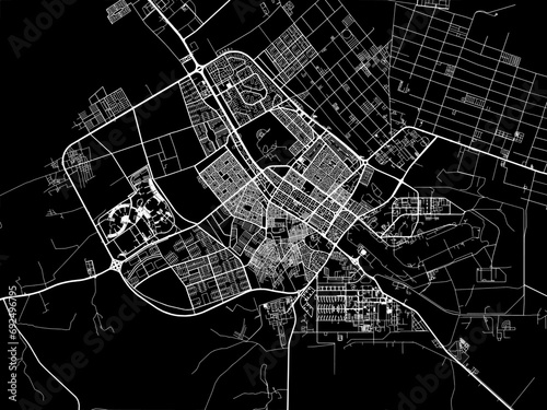 Vector road map of the city of Tabuk in the Kingdom of Saudi Arabia with white roads on a black background. photo
