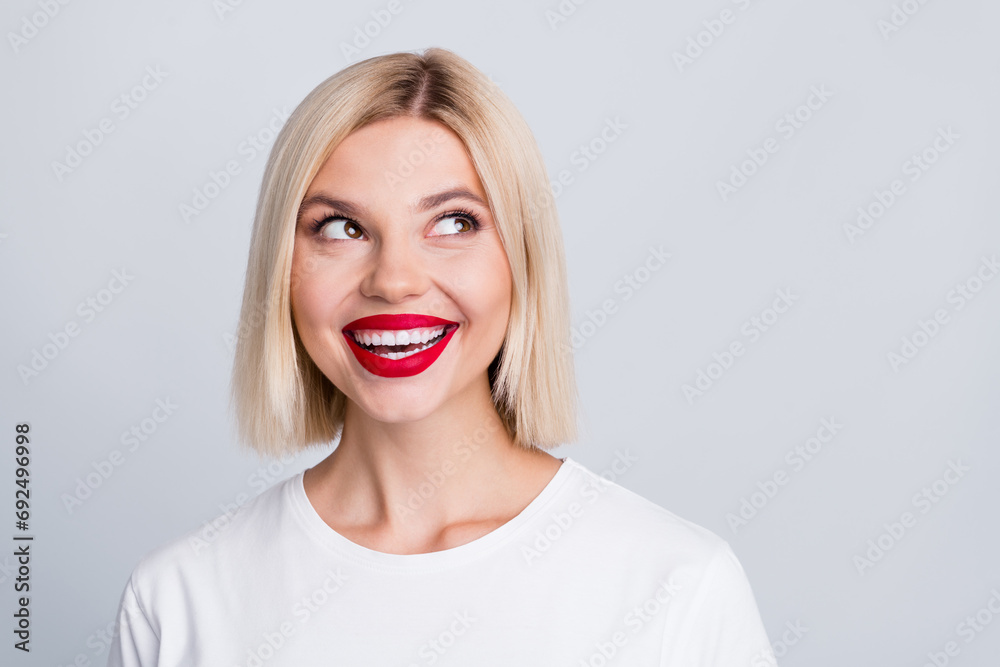 Photo of adorable lovely girl bright smile wear trendy clothes looking up news information blank space isolated on grey color background Photo of adorable lovely girl bright smile wear trendy clothes looking up news information blank space isolated on grey color background