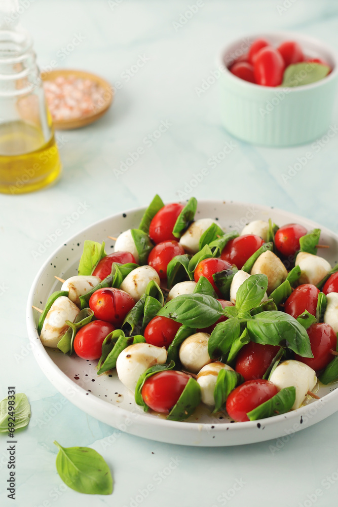 A plate with Italian salad caprese canape