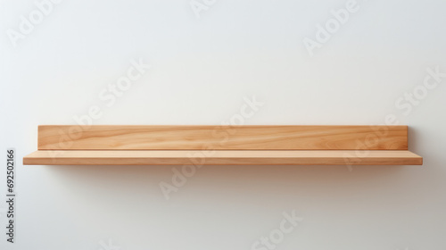 Minimalist wooden shelf on a clean white wall background with copy space photo