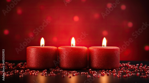 Valentine s Day background with candles and hearts on a red bokeh background.