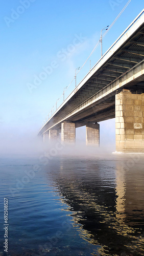 Bridge in frosty fog. photo