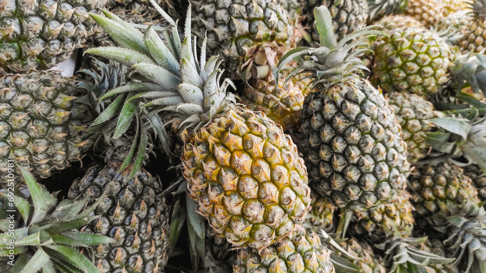 Full frame of pineapple background, showing tropical and juicy fruit in Indonesia. Full frame of pineapple background, showing tropical and juicy fruit in Indonesia.