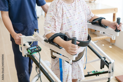 Physiotherapist helping senior woman in rehabilitation walking on airwalk machine