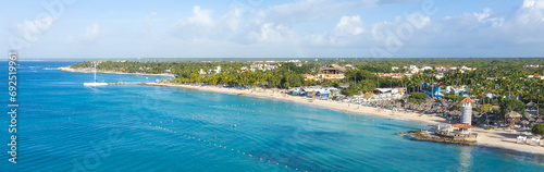 Dominicus beach at Bayahibe with Caribbean sea sandy seashore, lighthouse and pier. Aerial view. Long banner © photopixel