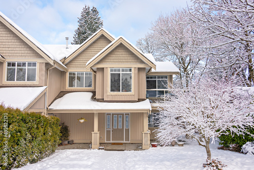 A perfect neighborhood. Entrance of nice residential house in snow