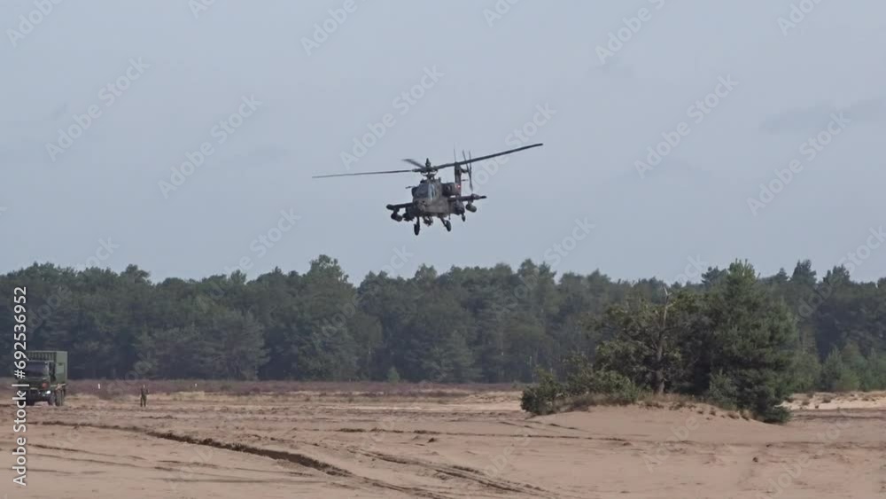 Military Helicopter flying low between trees Military Helicopter flying low between trees