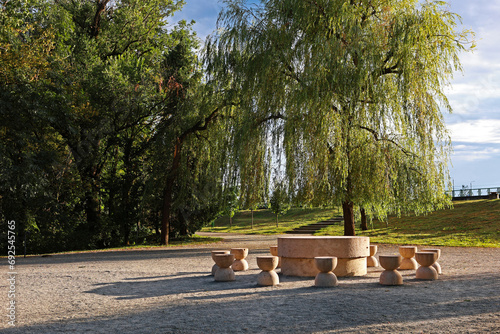 A beautiful park in Romania, Târgu Jiu. Stone chairs.