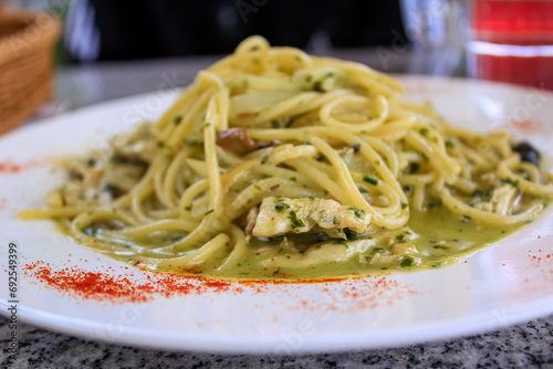 Fotografie Close-up of the pesto pasta on the table