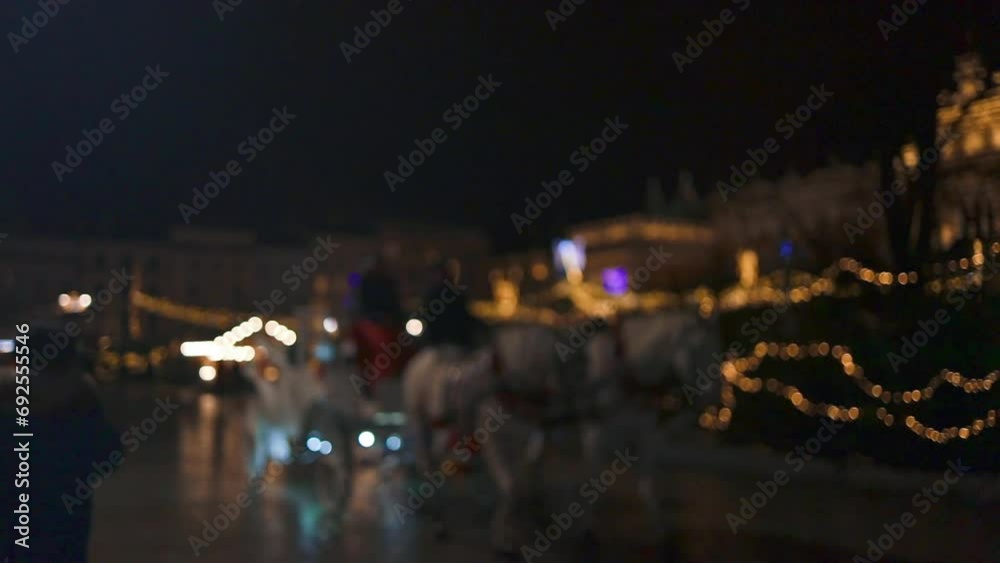 Blurred Christmas market in evening at town hall square in Krakow,Poland. Holidays, sale and retail concept Blurred Christmas market in evening at town hall square in Krakow,Poland. Holidays, sale and retail concept