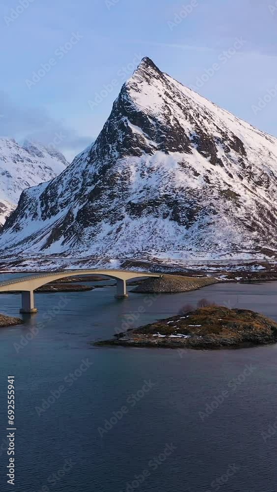 Vidéo Stock Fredvang Bridge, Car and Volandstind Mountain in Winter at ...