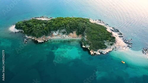 Flight Over the Albanian Riviera with Turquoise Water and a Small Island photo