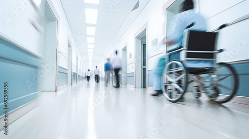 Long exposure blurred motion of medical doctors, nurses and patients in wheelchair in a emergency hospital ward wearing blue aprons, walking down a corridor. Generative AI.