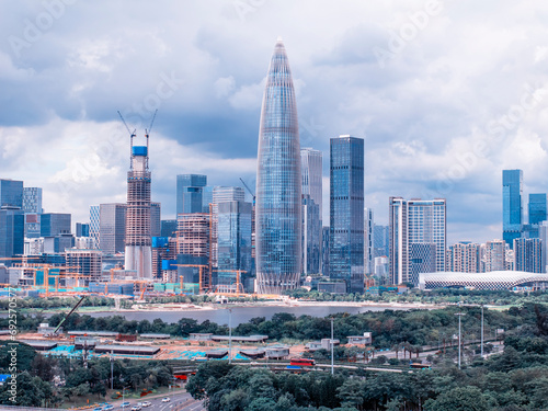 Drone fly over Shenzhen city central business district, aerial panorama China. photo