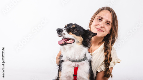 Portrait of a woman with a border collie dog with copy space