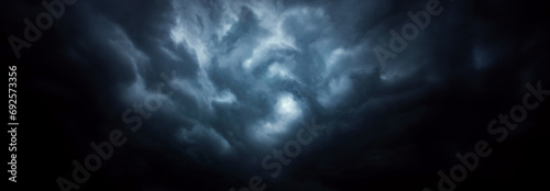 Dramatic sky with storm clouds before rain. Panoramic view of the stormy sky and dark clouds.  Concept on the theme of weather, natural disasters.