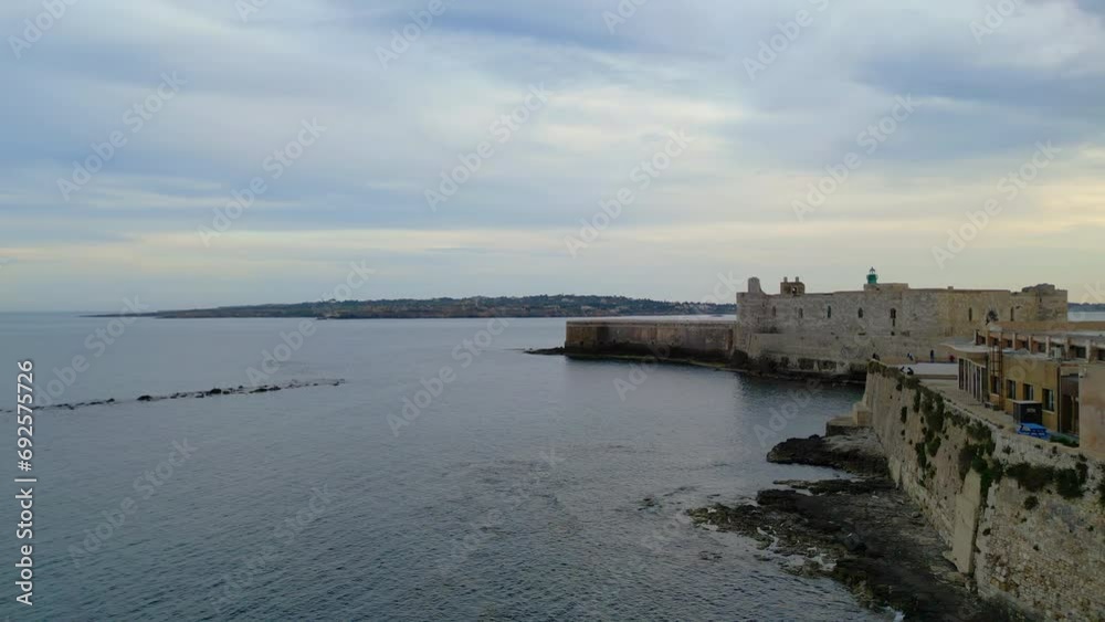 Syracuse, Sicily, Ortigia island, Etna volcano, UNESCO Italy. Europe heritage, Ortygia Historical centre, Piazza Duomo, Cityscape drone Aerial view of Castello Maniace citadel from above Syracuse, Sicily, Ortigia island, Etna volcano, UNESCO Italy. Europe heritage, Ortygia Historical centre, Piazza Duomo, Cityscape drone Aerial view of Castello Maniace citadel from above