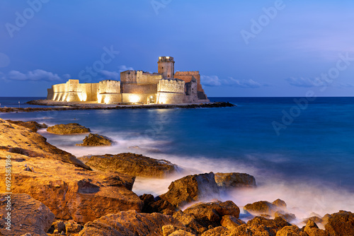 Isola di Capo Rizzuto. Calabria Italy. The Aragon castle at Le Castella at dusk. photo