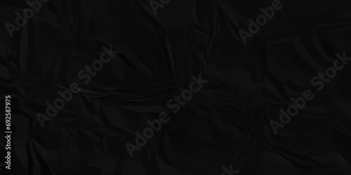 Dark black craft wrinkly paper crumpled texture. black fabric textured crumpled grunge paper background. panorama black paper texture background, crumpled pattern texture background. photo
