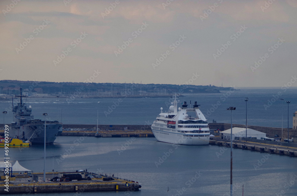 Luxury yacht cruiseship cruise ship liner Legend or Pride in port of Civitavecchia, Rome during Mediterranean cruising on grey and misty day for Eternal city excursions