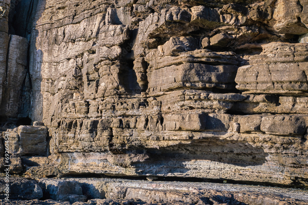 Close view of layers of eroded rocks on sunny day, Portugal