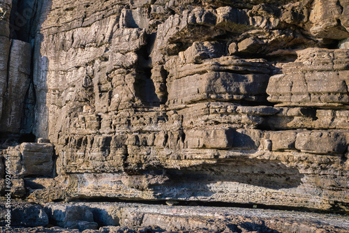Obraz na płótnie Close view of layers of eroded rocks on sunny day, Portugal w salonie