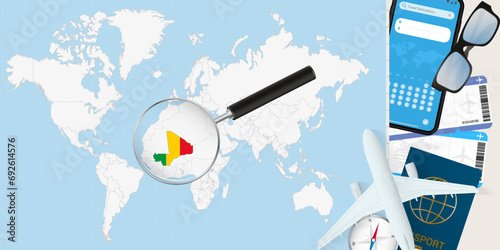 Mali is magnified over a World Map, illustration with airplane, passport, boarding pass, compass and eyeglasses.
