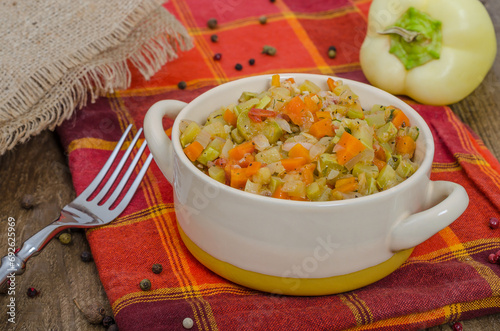 Bowl with vegetable stew on a checkered towel