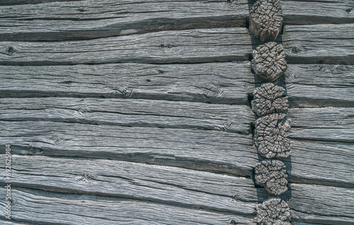 Part of a wooden wall with knots horizontal