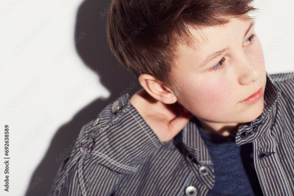 Teenager, fashion and boy thinking in studio, white background or dream of future. Cool, style and child with ideas, creativity and confidence in trendy clothes, outfit and personality on backdrop Teenager, fashion and boy thinking in studio, white background or dream of future. Cool, style and child with ideas, creativity and confidence in trendy clothes, outfit and personality on backdrop
