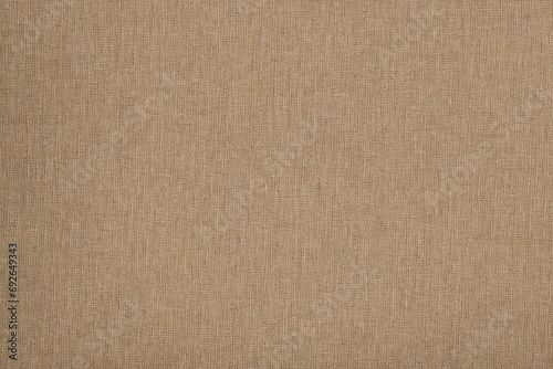 Texture of luxurious brown fabric for cutting and sewing clothes. Background made of dense material. Textile