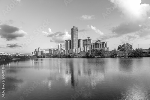 skyline of Austin in early morning light with mirroring city in the colorado river  Texas