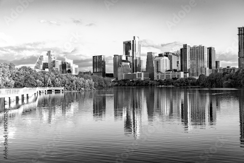 skyline of Austin in early morning light with mirroring city in the colorado river, Texas © travelview