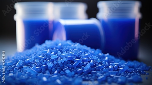 Close up of a two stacks of blue plastic polypropylene granules on a table