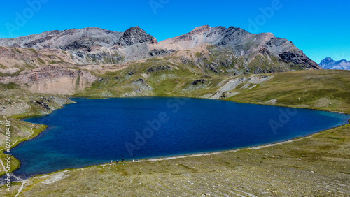 Landscapes with mountains and lakes. Area view with shades of colors  blue water and green meadows