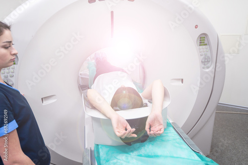 Doctor doing computed tomography for female patient stock photo. Medicine diagnostic concept