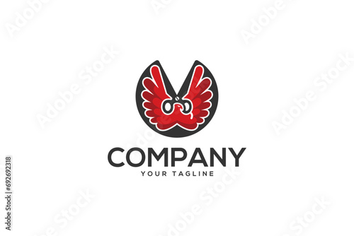 Creative logo design depicting an eagle with scissors incorporated in the design. 