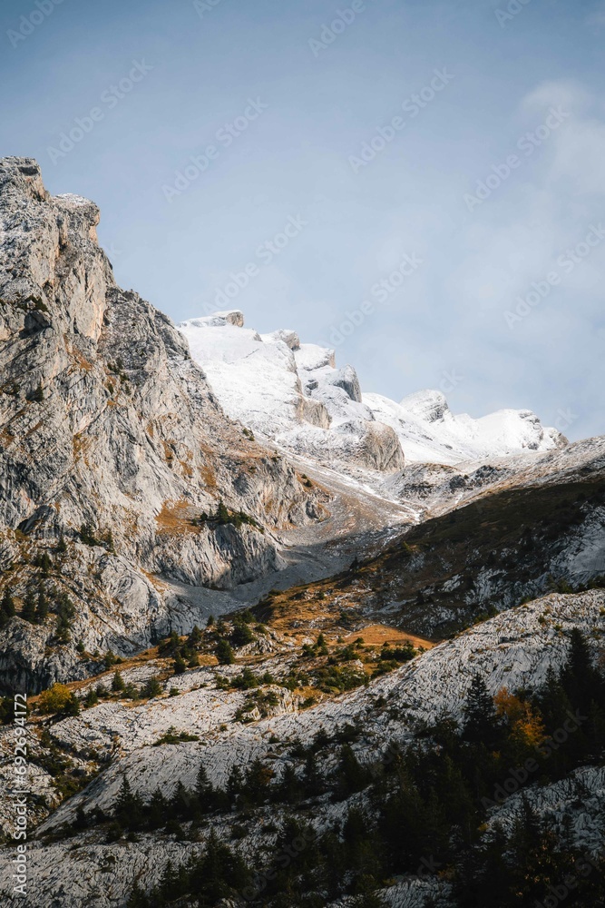 Mountains covered in snow in French Alps. Christmas winter vacations in mountain environment in France, Europe.