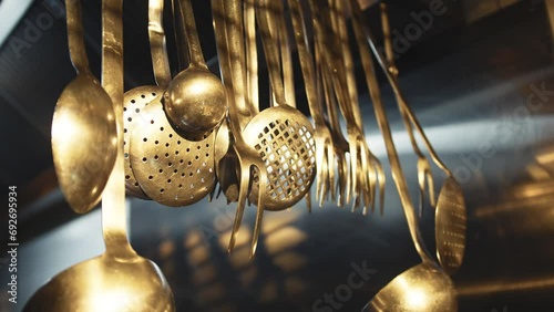 Hanging ladles in a restaurant kitchen photo