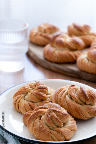Traditional Swedish cardamom buns kardemummabullar made of yeast dough photo