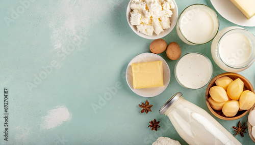 assorted dairy products on wooden table, natural lighting. Caption space.  photo
