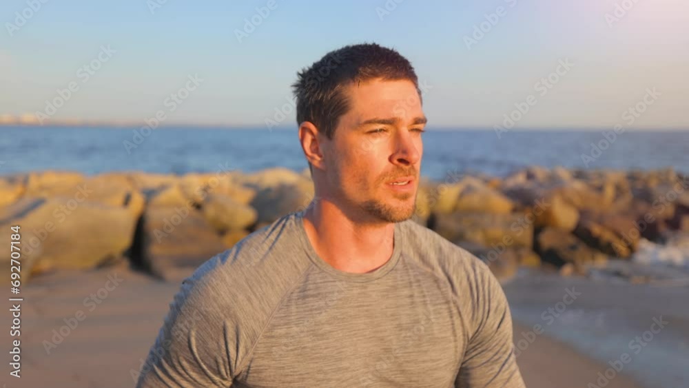 Athletic man jogging at the beach in Southern California. Slow Motion. Athletic man jogging at the beach in Southern California. Slow Motion.