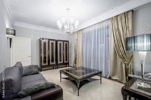 Classic interior with table, marble, chandeliers, wood